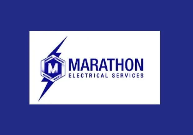 Logo for Marathon Electrical Services featuring the word "MARATHON" in bold blue letters, accompanied by a lightning bolt graphic and a hexagon shape. The background is solid blue.